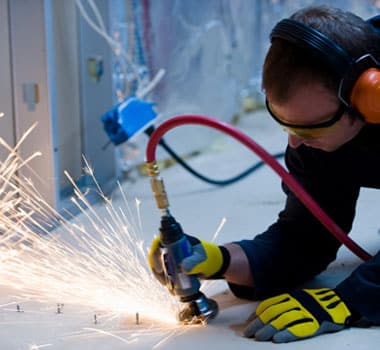 man working welding has hearing aids needing cleaning