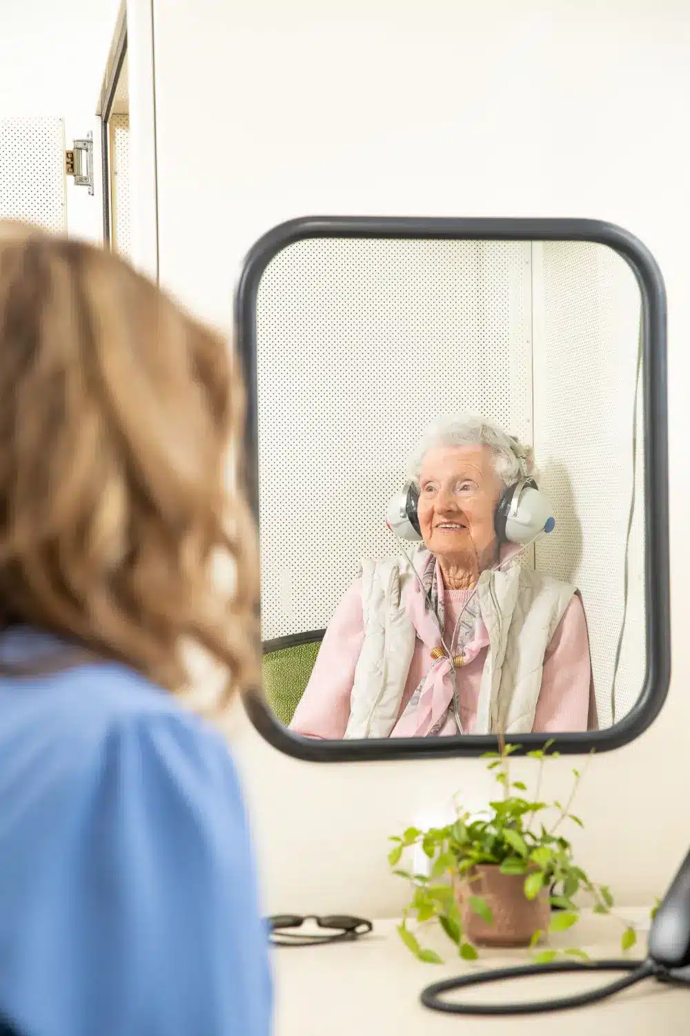 woman in hearing assessment with audiologist