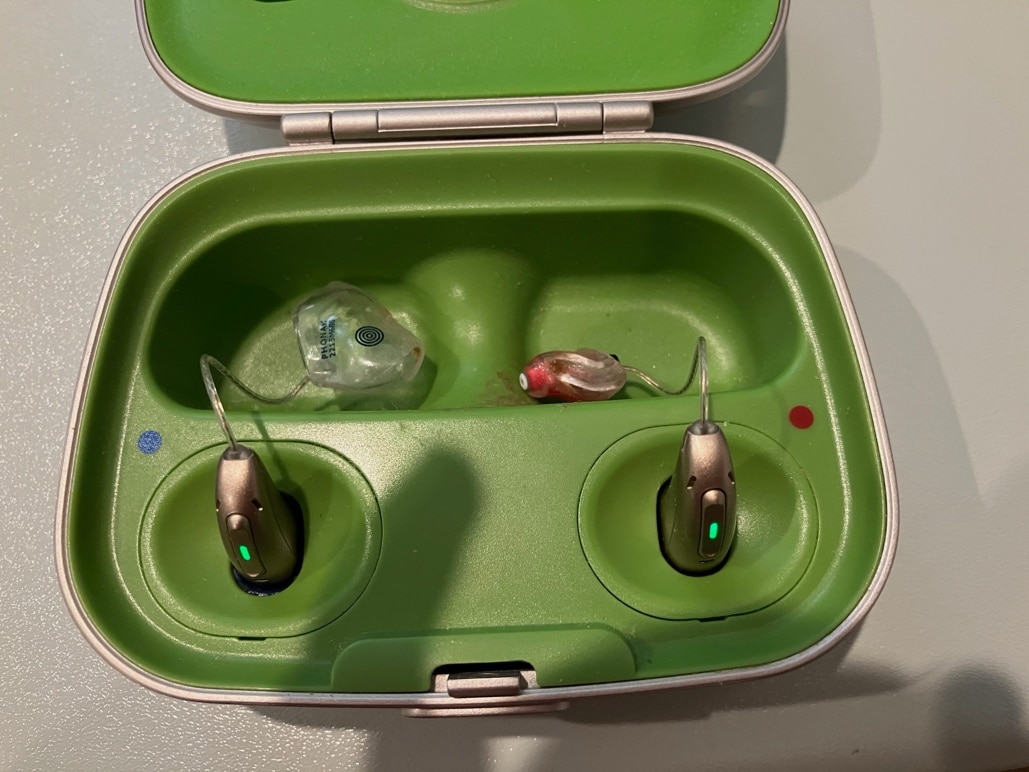 Jennys rechargeable Phonak hearing aids, on charge